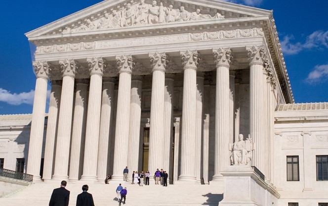US Supreme Court Building With People On Steps