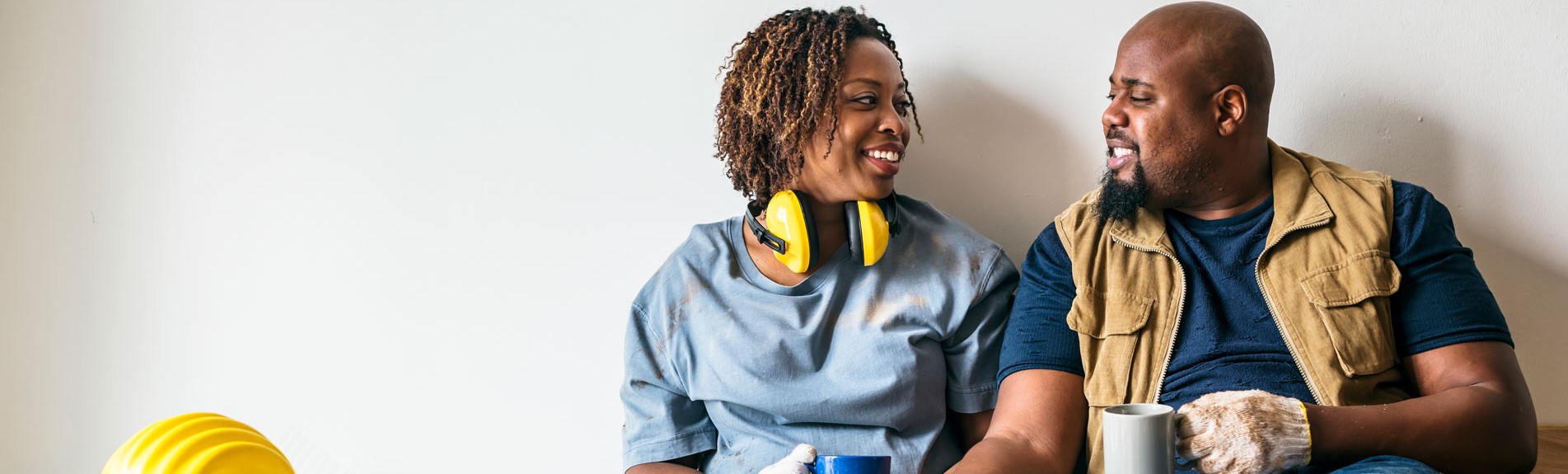 African American Male Construction Worker With Spouse