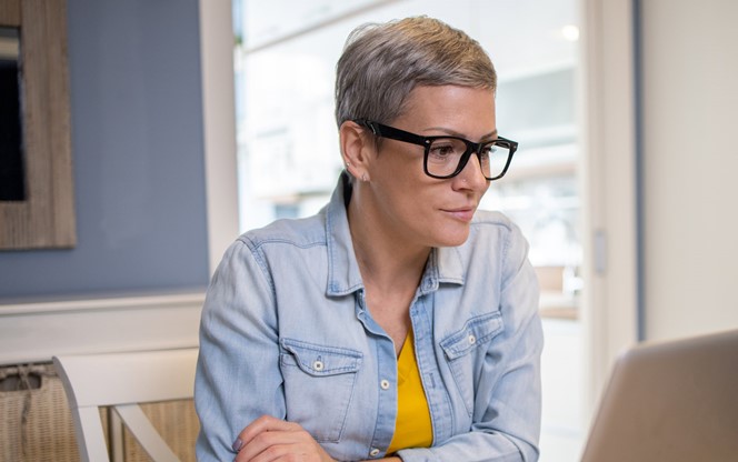 Woman Working On A Laptop At Home